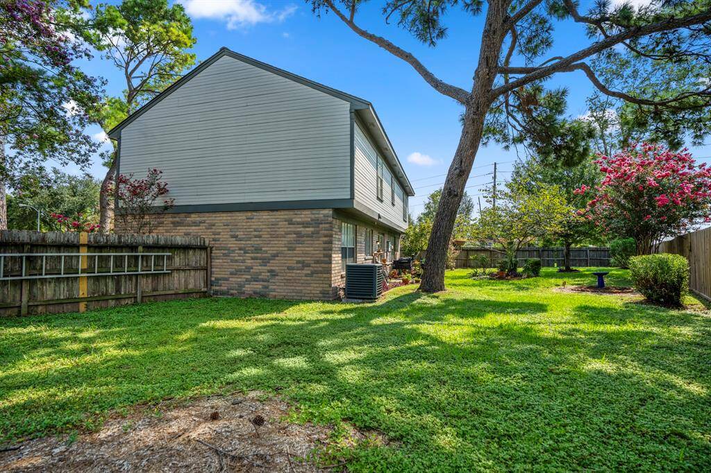 This large fenced in backyard offers plenty of space for outdoor activity