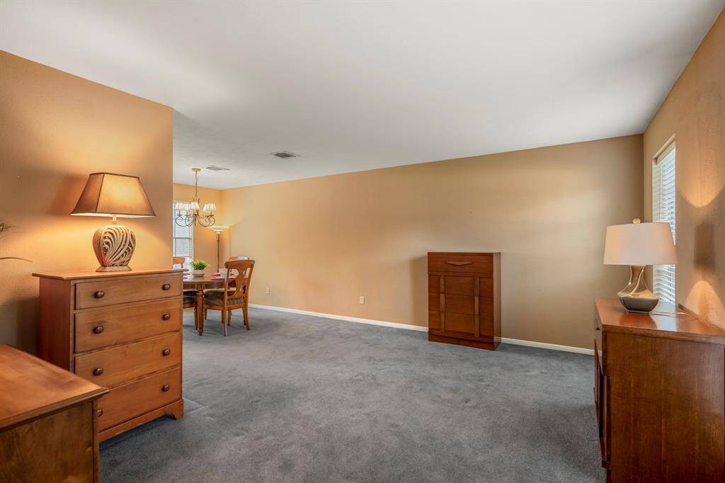 As you enter the home, the formal living and dining room are off to the right side of the entryway