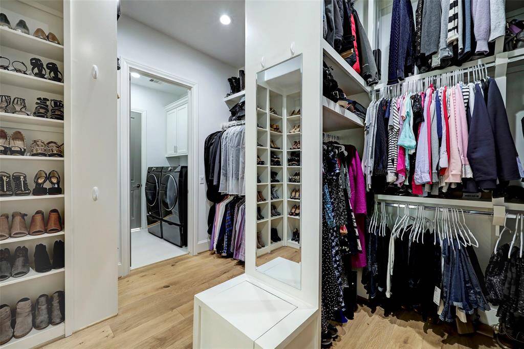 Primary Walk-in Closet is just off the bathroom and is one of TWO.