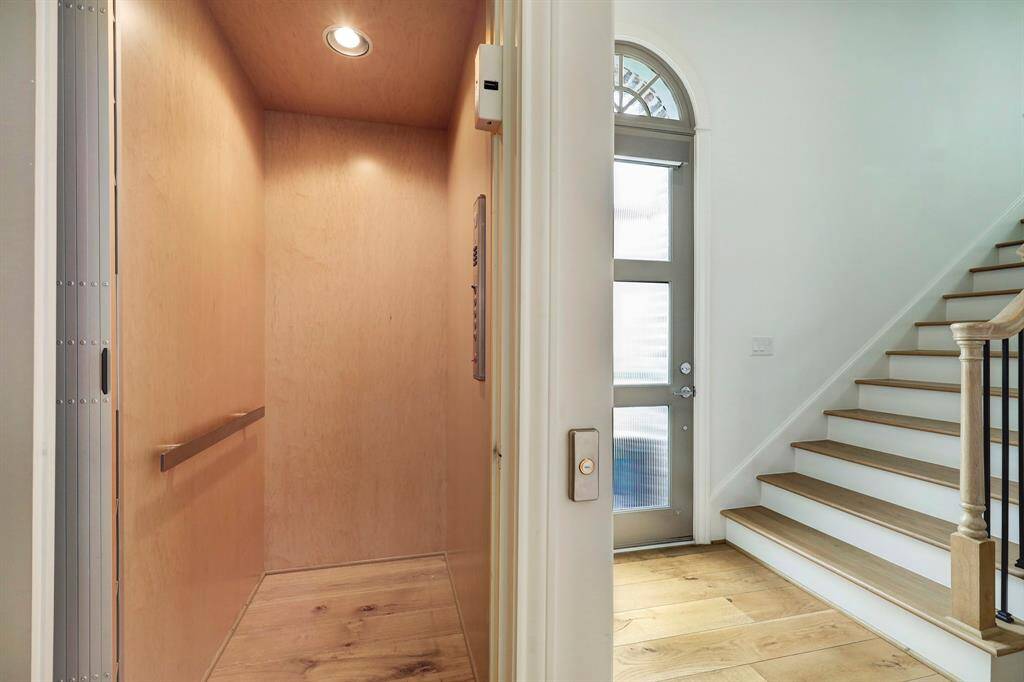 There's an elevator just by the front door that accesses all three floors.