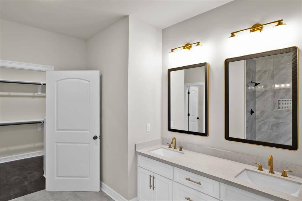 Luxurious en-suite bath leading to your spacious walk-in closet.