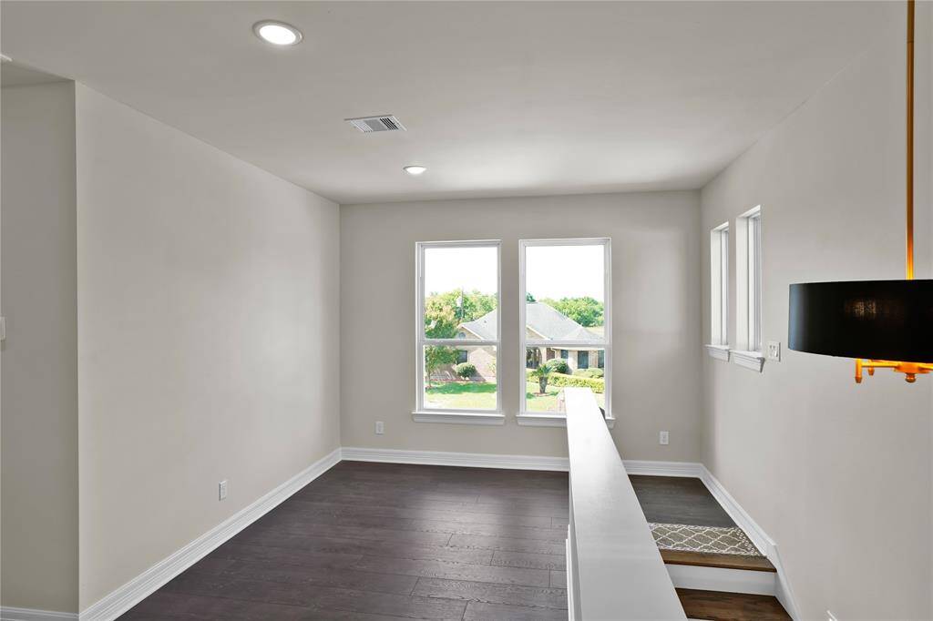 Enjoy privacy with all bedrooms located upstairs, accessed via a spacious, open hallway.