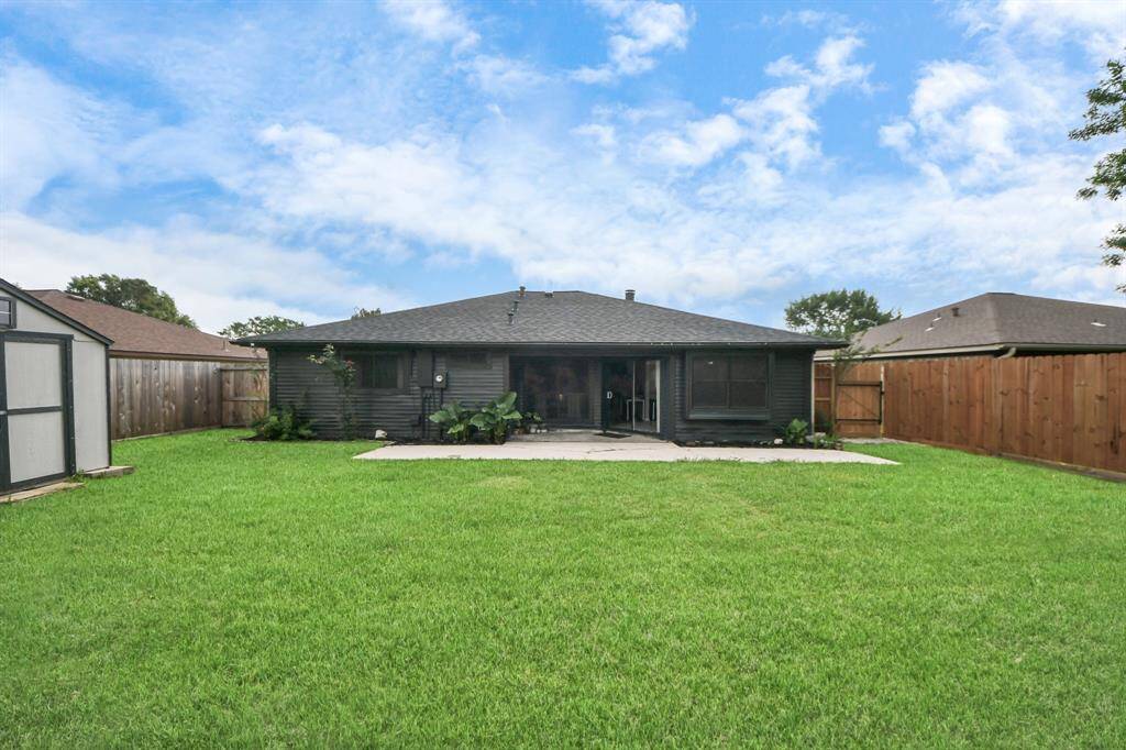 Your dog will love this yard!  Enjoy evenings on your covered back patio