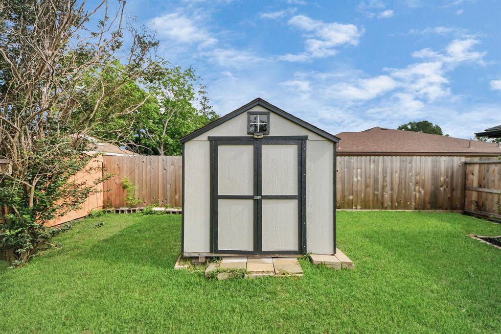 Storage shed included!