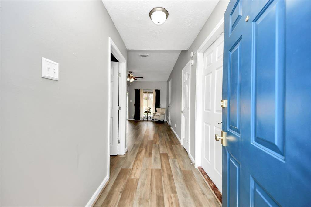 The entry way offers the primary to the left and garage to your immediate right.