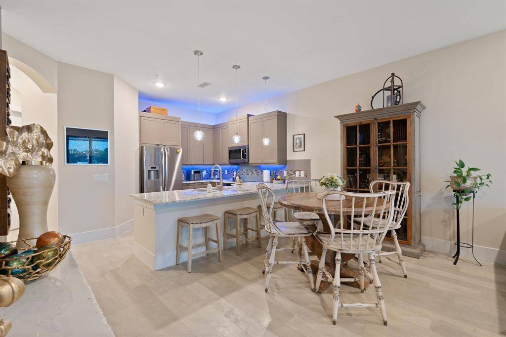 Dining and kitchen from primary bedroom door.