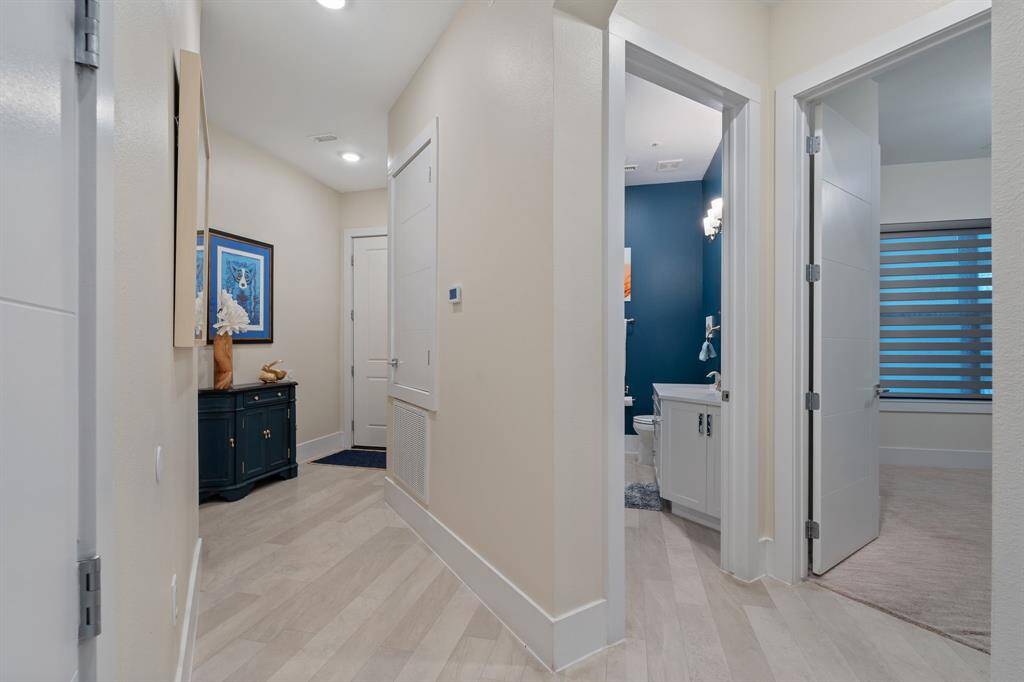 Looking toward entrance on left, 2nd bath in middle, 2nd bedroom on right.