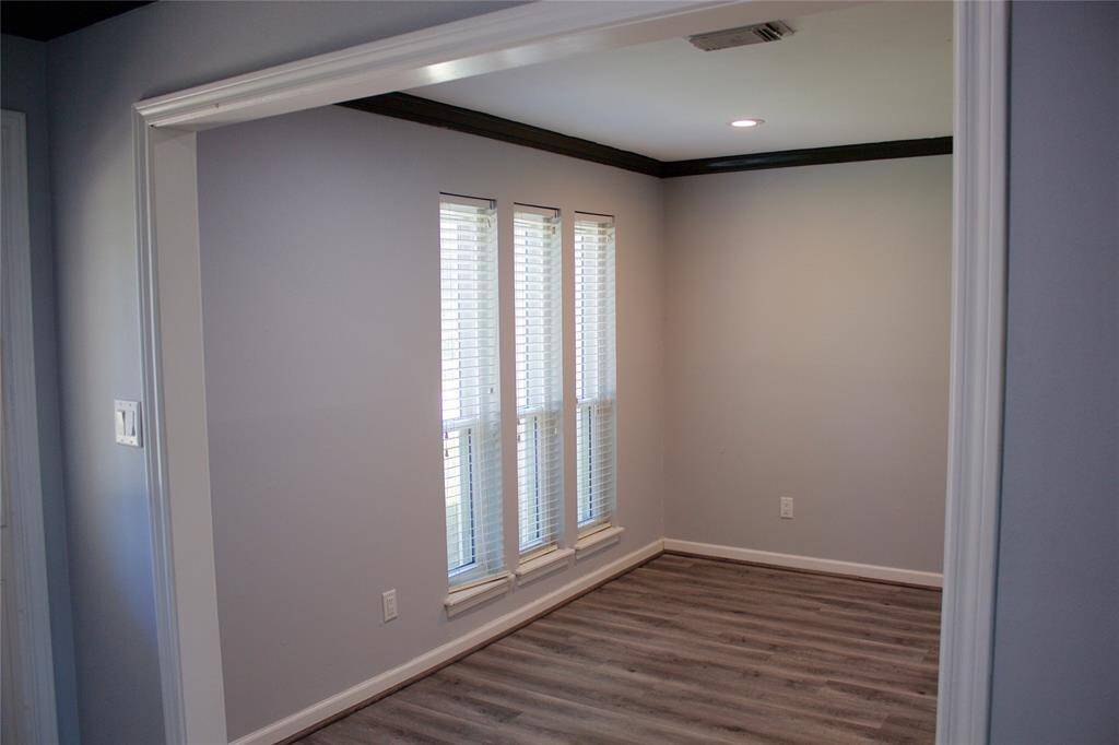 Bright and versatile living space, perfect for a formal setting or your creative touch.
