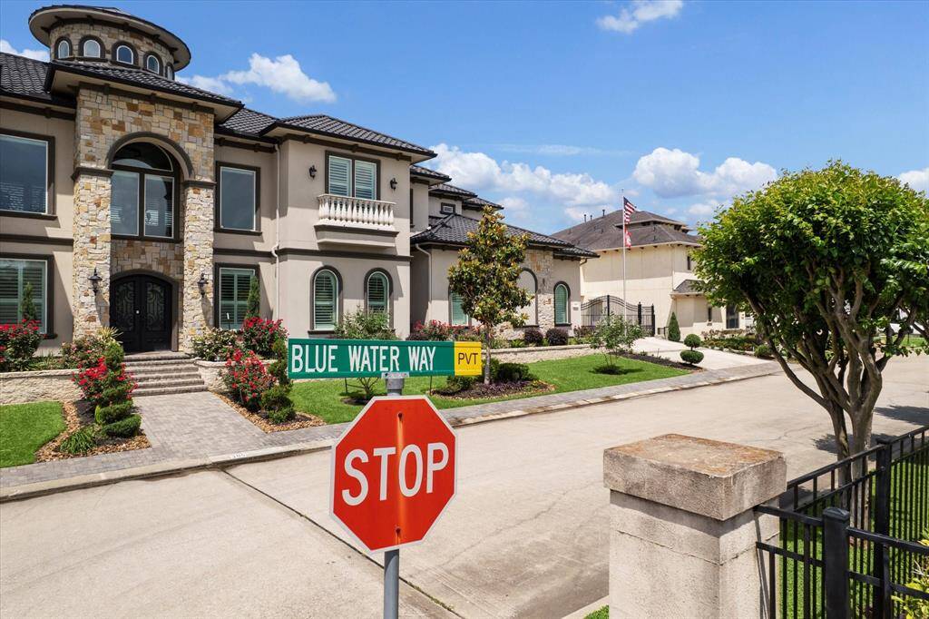 211 Blue Water Way located on a private gated street of luxury homes on a canal with quick access to Clear Lake.