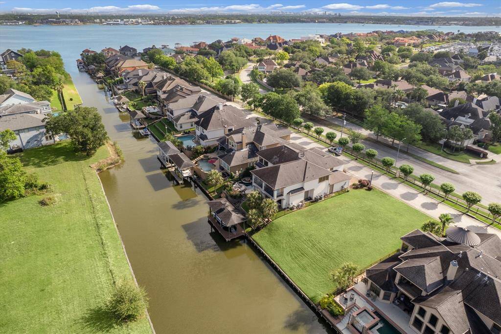 Quick access to Clear Lake from the private canal. Luxurious waterfront living awaits with shopping and dining nearby.