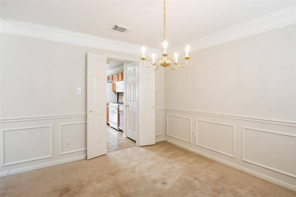 Formal Dining Room with double doors to the Kitchen