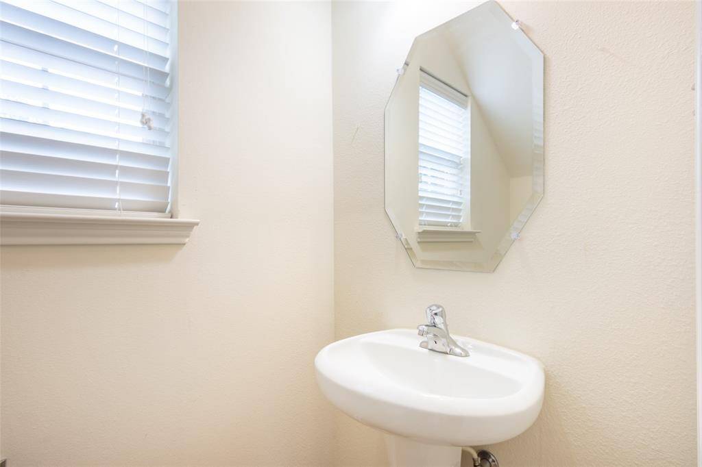 Downstairs Half Bath located under the Stairwell
