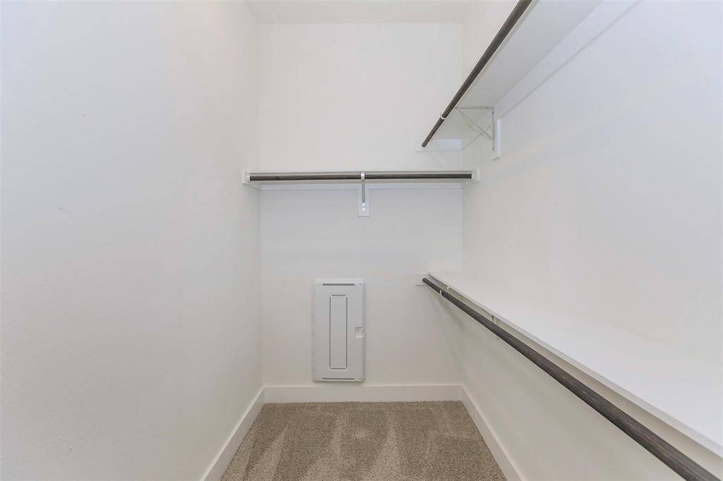 Oversized walk in closet in primary bedroom!