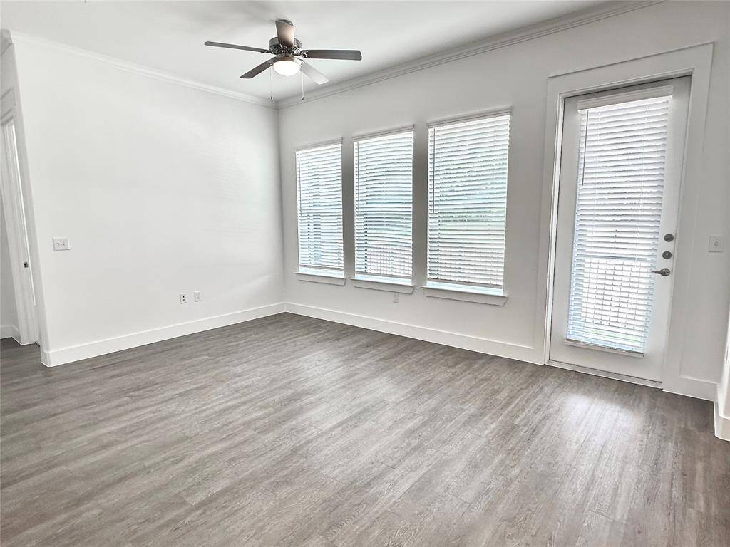 Large windows and 10 ft ceilings with crown molding