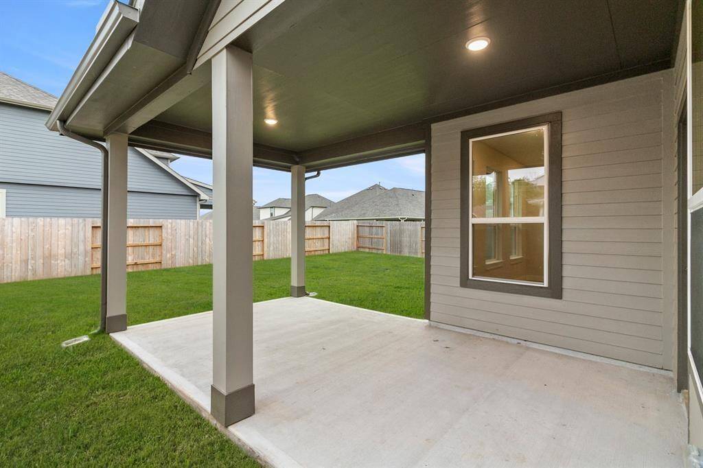 Imagine stepping into your own personal oasis—a spacious covered back patio that invites you to savor every moment outdoors, regardless of the weather.