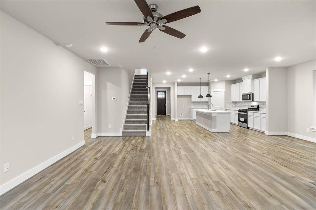 The stairs in this home are neatly tucked away, to not disrupt the privacy and flow of this home.