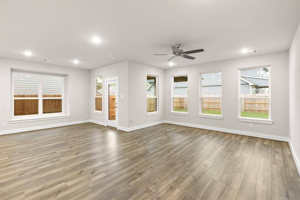 The spacious living and dining area flows together beautifully, creating an inviting atmosphere perfect for both relaxation and entertainment.