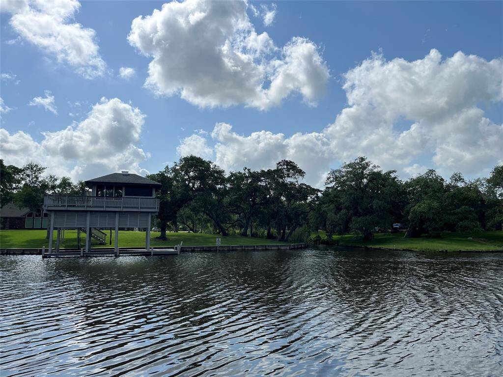 This is your across-the-bayou neighbor's boathouse. It's a gorgeous view for them and for you! You'll get to see sunsets too!