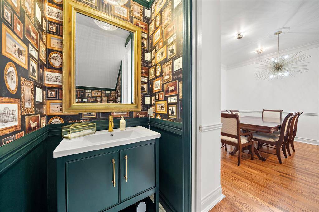 This stunning half bath is conveniently located off the living/dining areas.