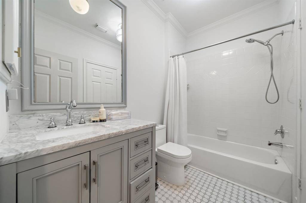 The recently updated hall bath with direct access to Bedroom #2 and the hallway.