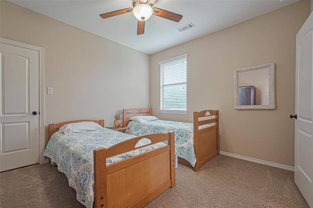 Comfortable and well-sized fourth bedroom, connected to a Jack and Jill bath for added convenience and privacy