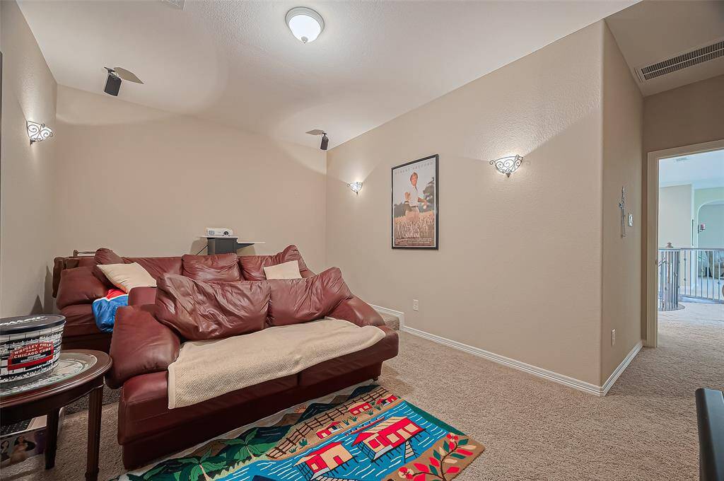 Your very own home cinema! This media room is ready for movie marathons and game-day fun.