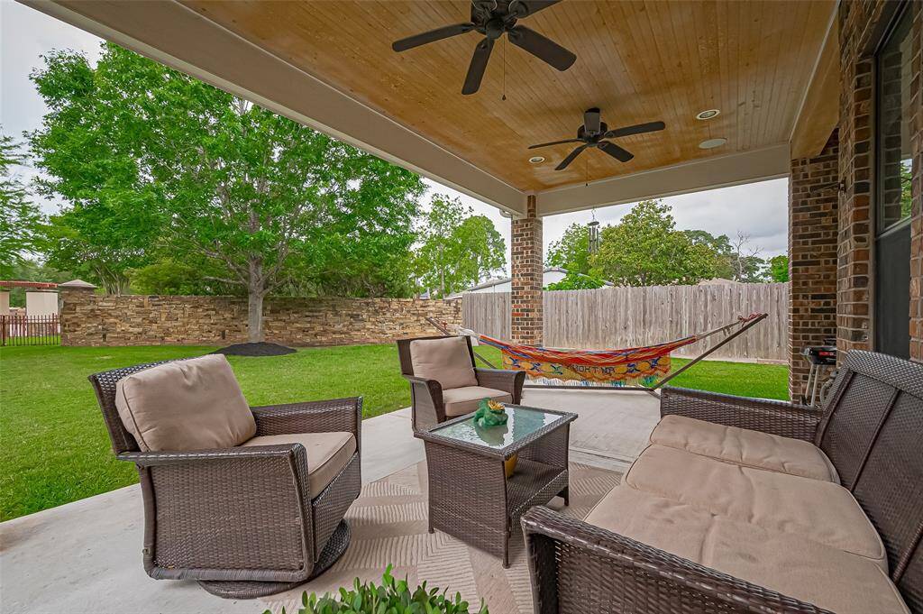 Take in the serene lake view right from your covered patio, where outdoor comfort meets natural beauty.