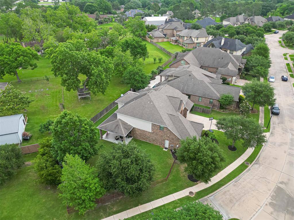 Mature trees enhance curb appeal and add natural privacy.