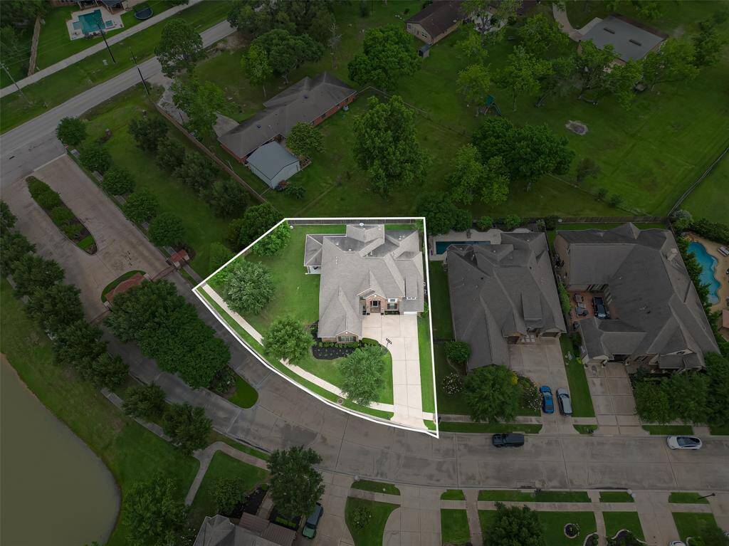 Surrounded by mature trees and just steps from the lake, this home offers a peaceful natural setting with scenic beauty all around.
