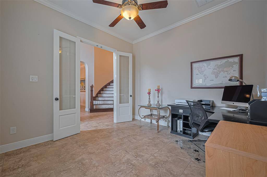 Private home office with ample natural light, ideal for remote work or study.