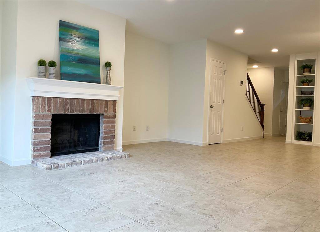 Delightful wood burning fireplace with a brick hearth.   This home is move in ready today!