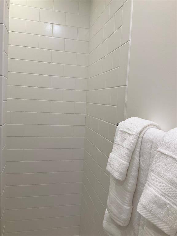The secondary bath shower allows you to walk right in and not worry about hard water stains on shower glass doors.