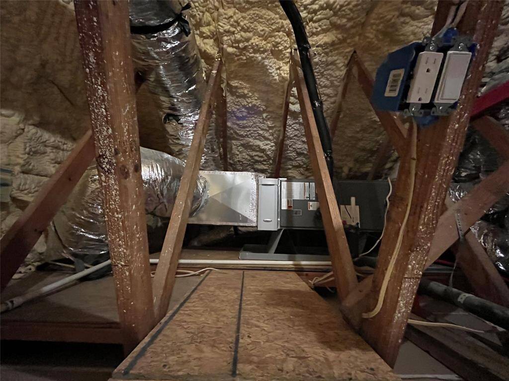 The attic space offers additional foam insulation for energy efficiency.  Best part is the hot water heater is in the garage and not the attic!