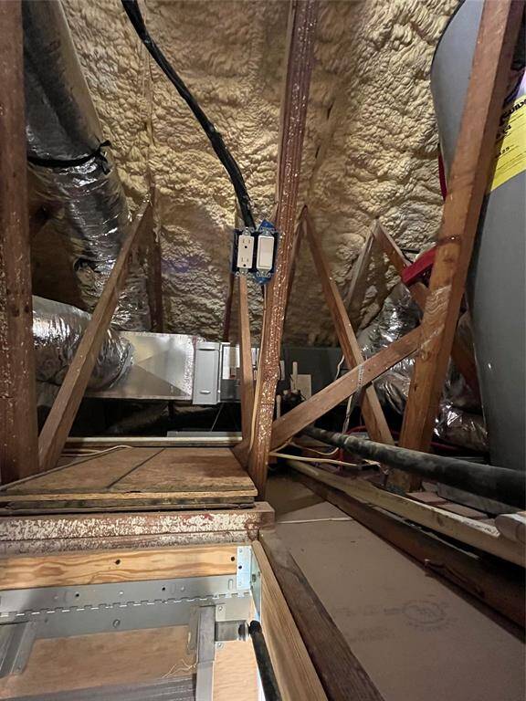 The attic space offers additional foam insulation for energy efficiency.  Best part is the hot water heater is in the garage and not the attic!