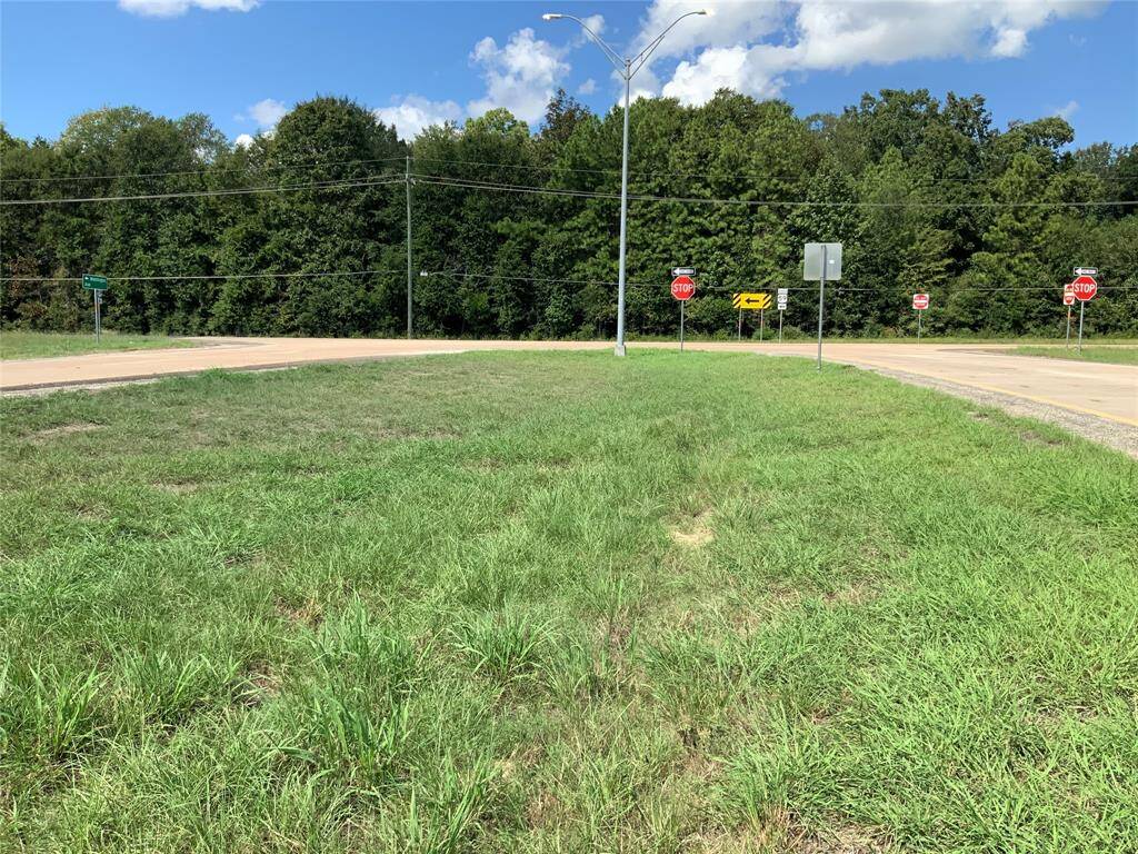 Property Id #255221 is directly behind yellow arrow sign and extends left and right