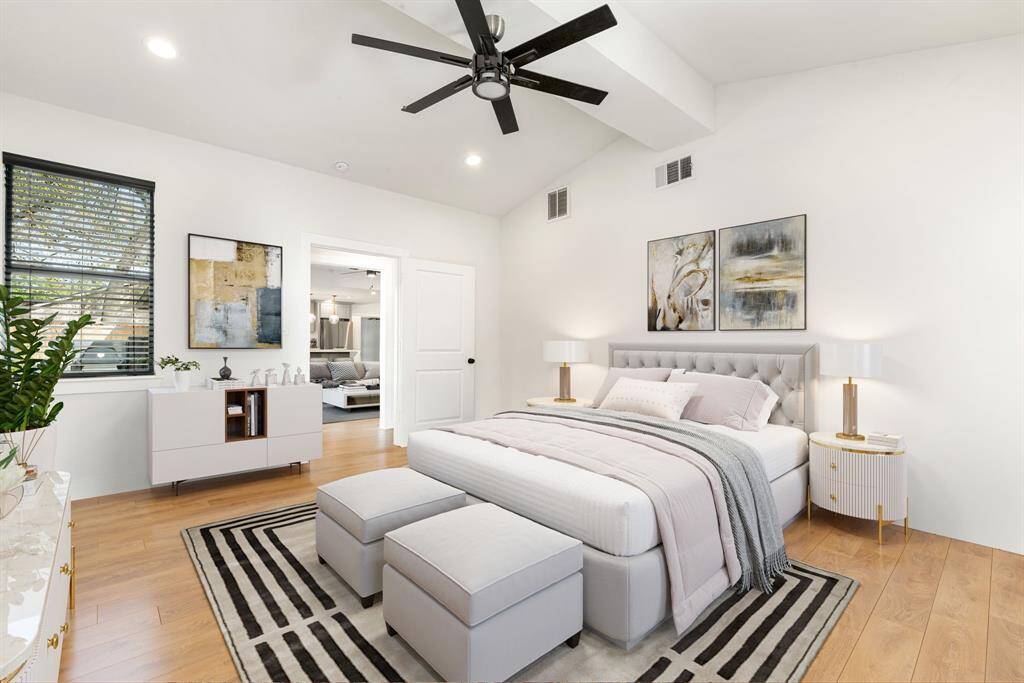 What a wonderful place to come home to, this stunning primary suite greets you with gorgeous wood floors, a warm custom paint, high ceiling, crown molding, ceiling fan with lighting, lovely arched windows with blinds allowing in natural light brightening up this spacious primary bedroom, with extra space for a seating area. *Virtually Staged