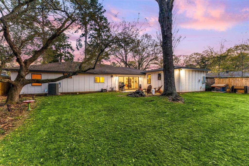 Revel in a large, versatile yard that offers endless possibilities, perfect for hosting gatherings, gardening, or simply unwinding in nature.