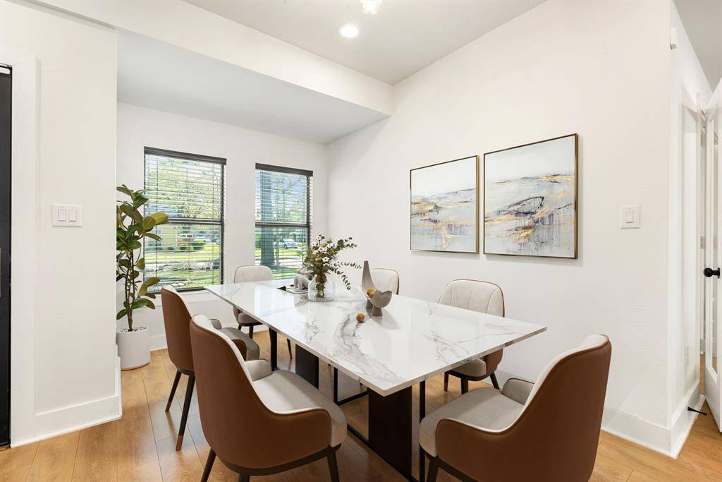 Make memories gathered around the table with your family and friends! This dining room features high ceilings, crown molding, chair rail, large windows, and wood style floors. *Virtually Staged