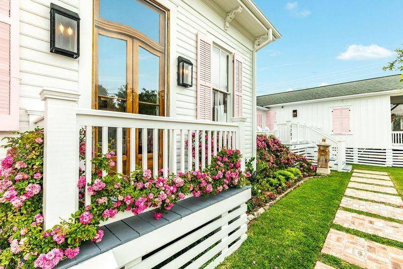 Beautiful flowers adorn the front landscape