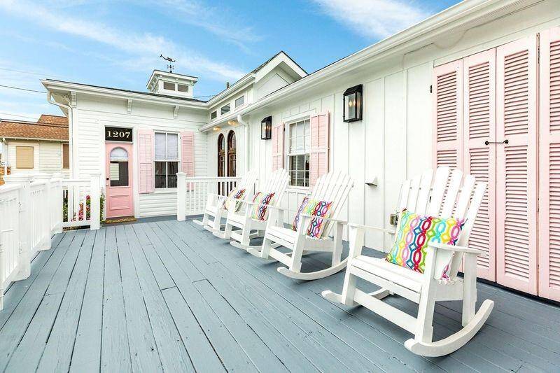 Large front porch with rockers allows for outdoor entertaining