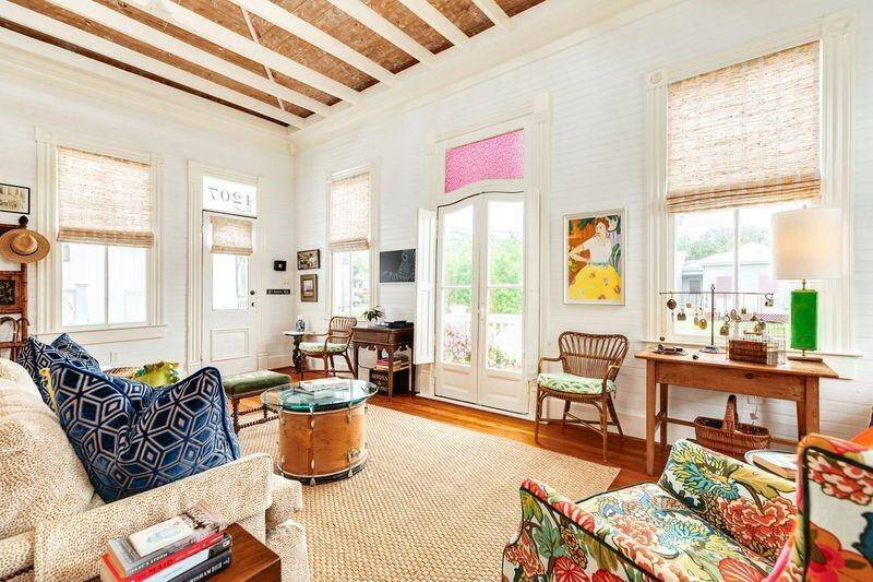 The living room with lots of natural light, high ceilings, and a cupola welcomes guests