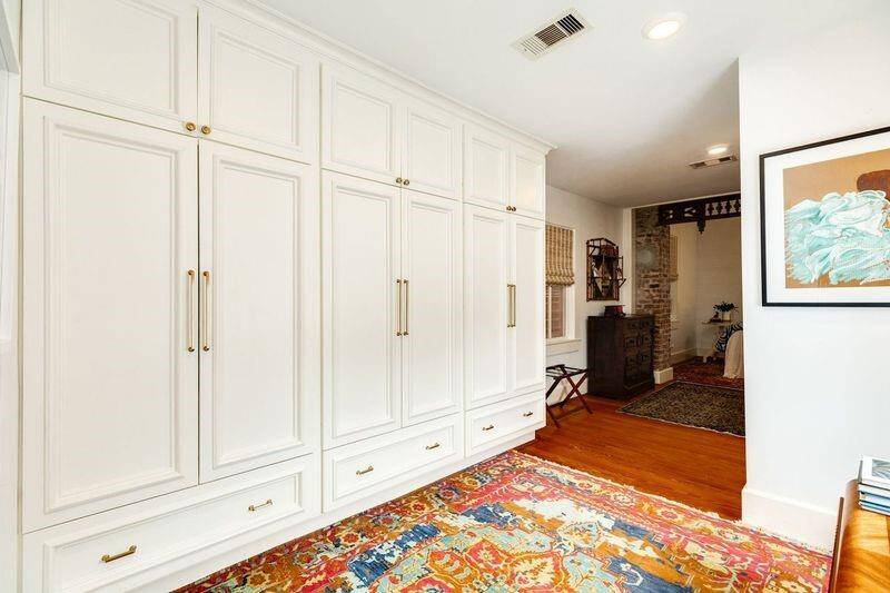 Large dressing area and custom closets leads into the primary BR area