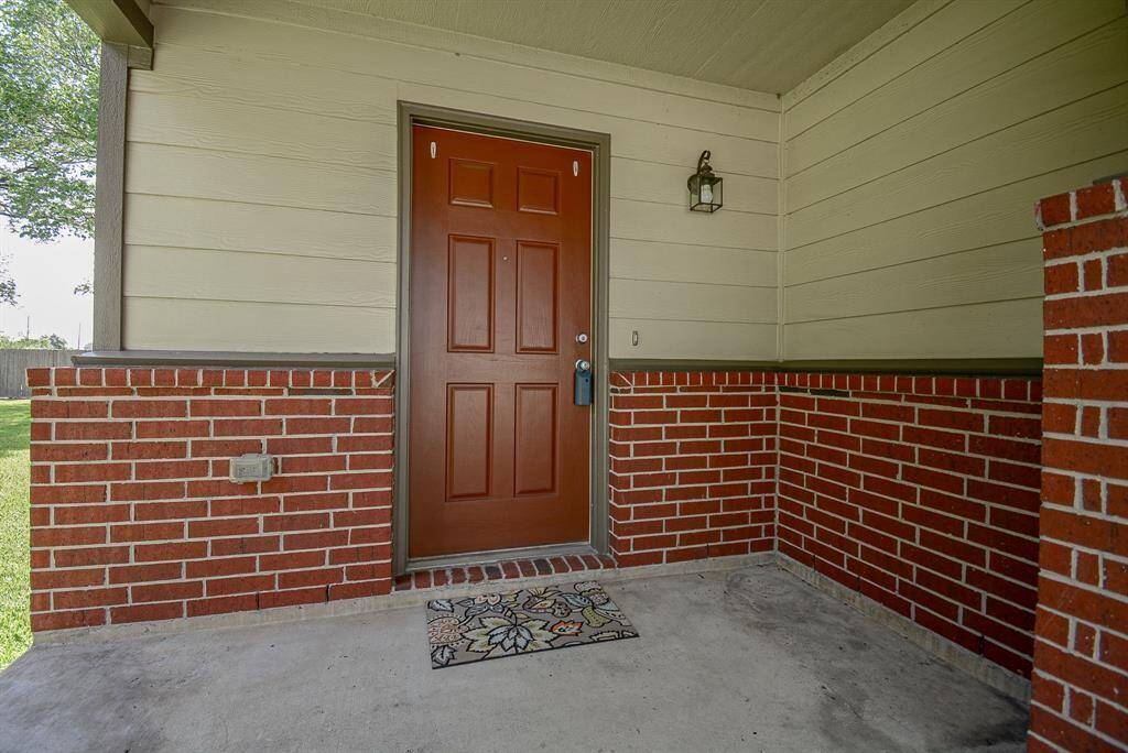 Covered front porch with charming front lamp
