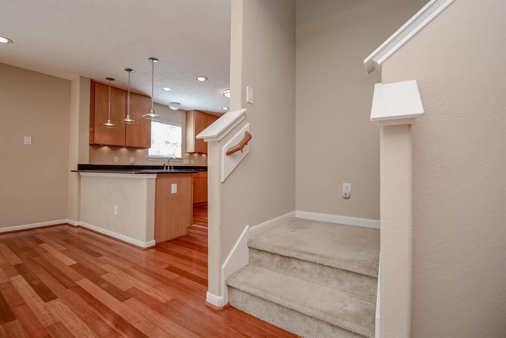 Powder/guest half bathroom behind the stairs - perfectly located privately away from kitchen and dining areas