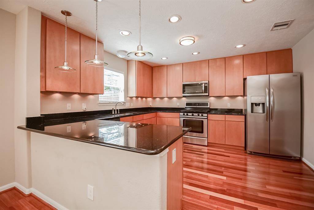 Gorgeous kitchen with stainless steel appliances. Refrigerator and washer/dryer included