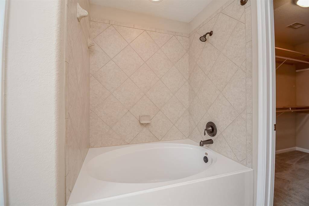 Closer view of primary garden tub/shower combo