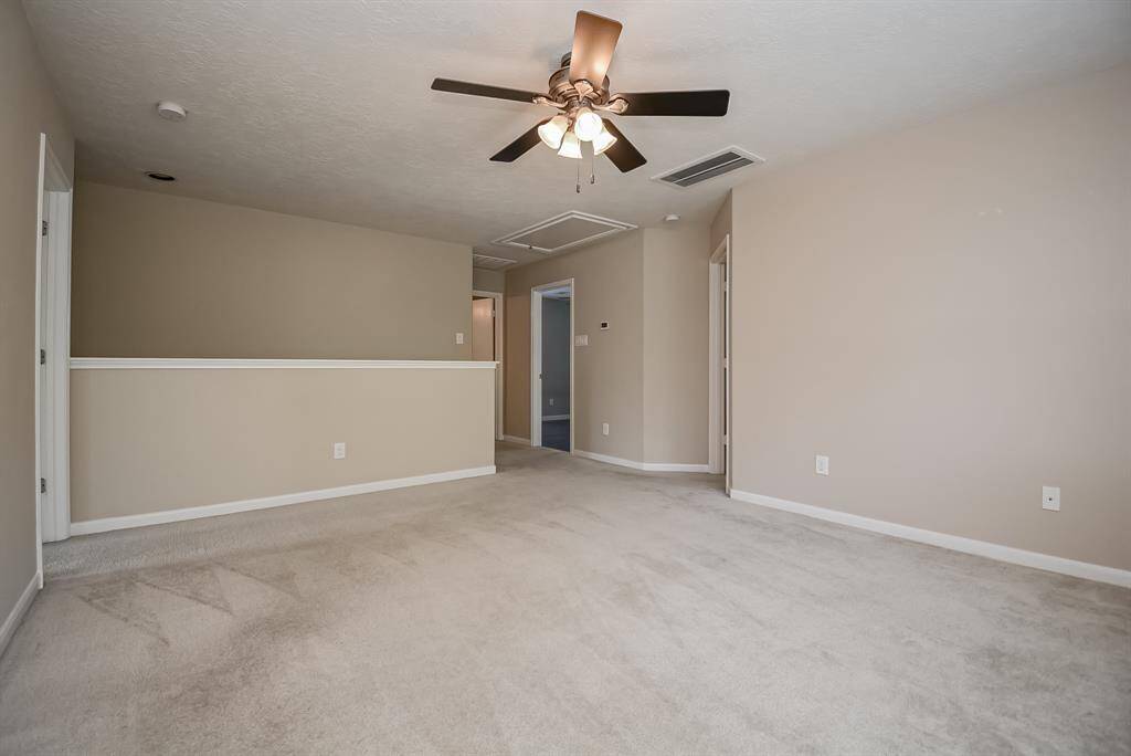 Open game room with lots of natural lighting