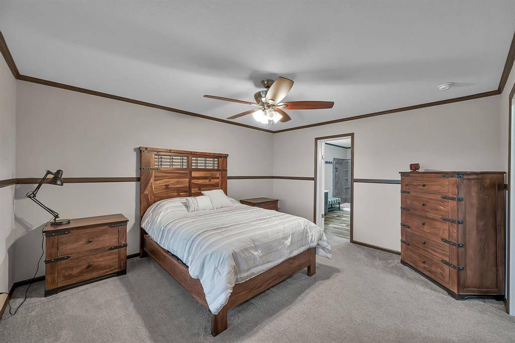 This spacious 15' x 13' primary bedroom can easily accommodate your bedroom furniture.