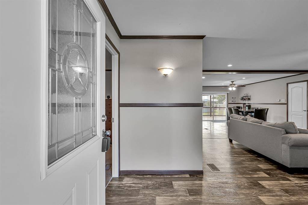 Upon entering you're greeted with a meticulously-maintained interior. Crown molding, trim accents, and a warm color palette invite you in.