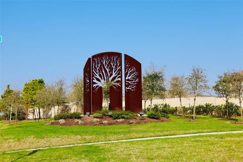 Discover stunning metal art at the entrance, adding elegance and charm to your new home.